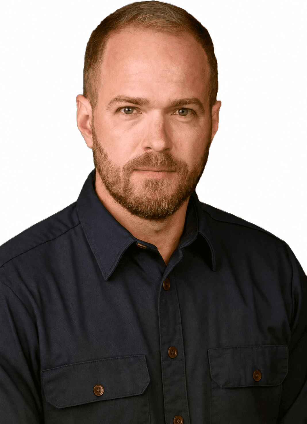 A bearded man with short brown hair wearing a dark blue button-down shirt.